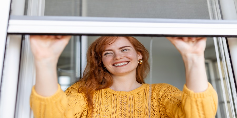 woman-hand-hold-retractable-pleated-insect-screen-holder-open-close-window-mosquito-nets.jpg